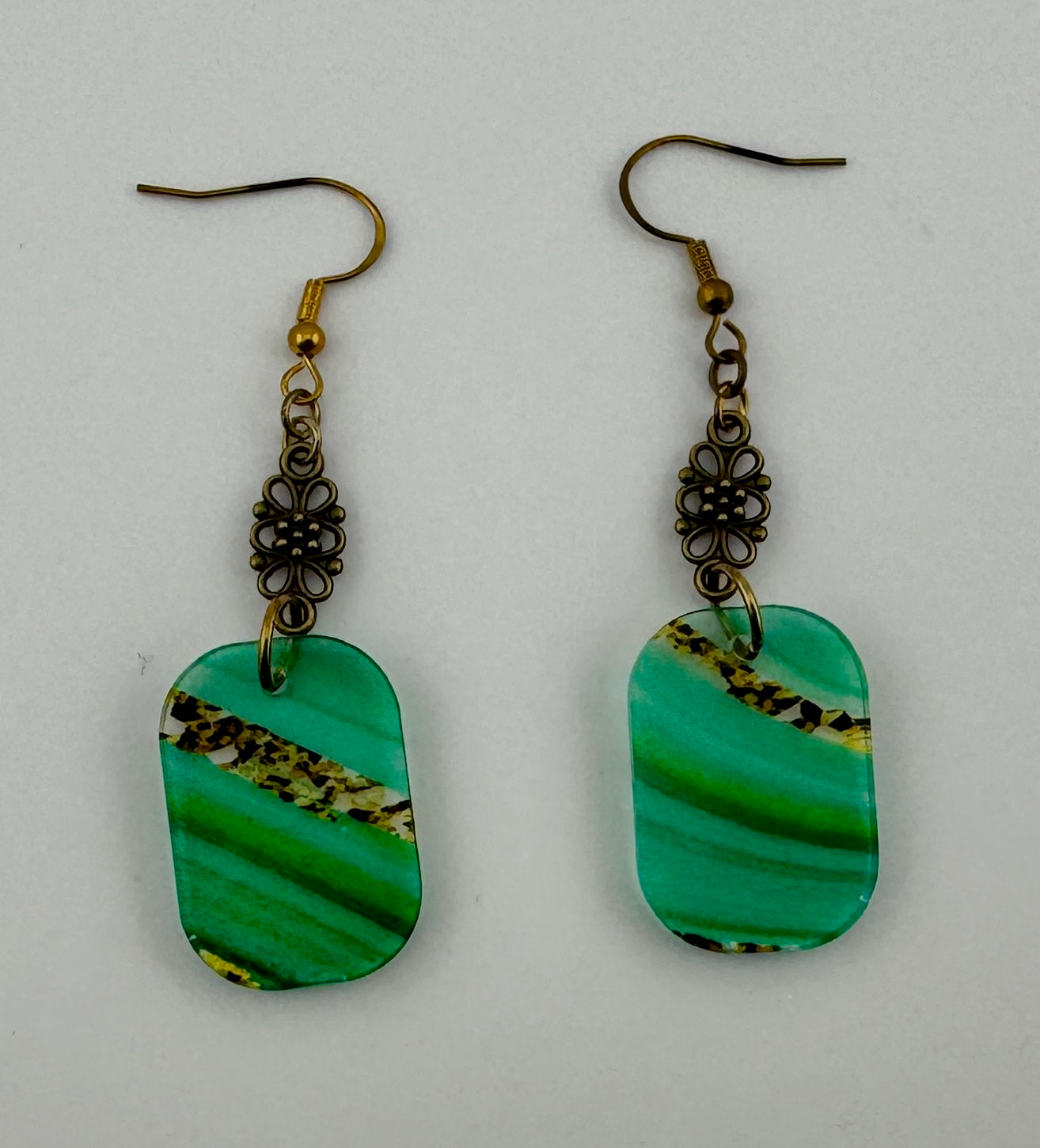 Boho Emerald Swirl Dangles – Translucent Acrylic with Vintage Bronze Details